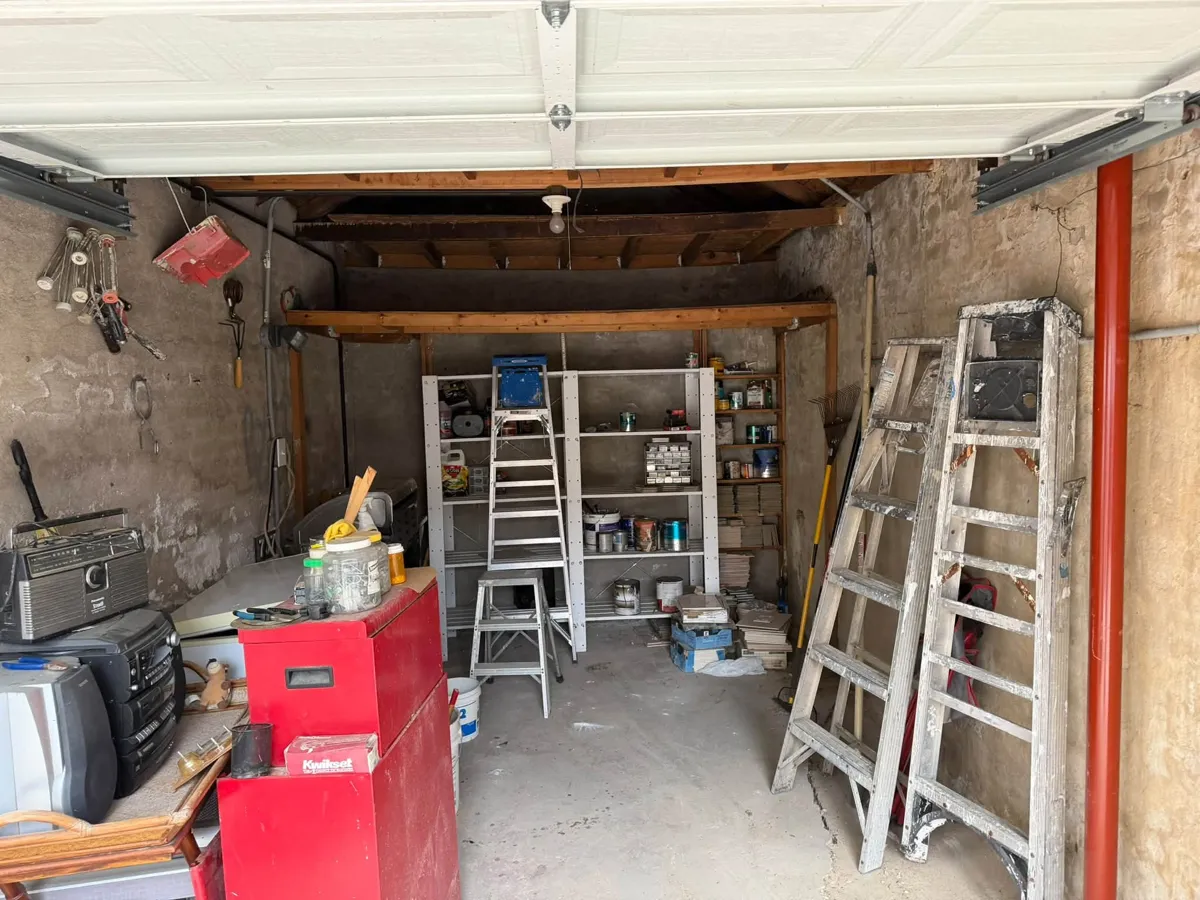 Same garage with the floor cleared after the cleanout